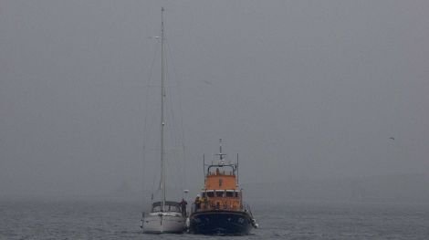 Yacht being towed