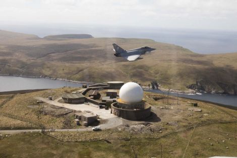 A Typhoon jet flying over the Saxa Vord radar base. Photo: MoD