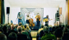 Della Mae rounding off a splendid night of music at Cunningsburgh Hall. Photo: Lieve Boussauw.