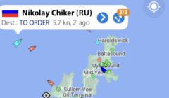 A map showing the vessel "Nikolay Chiker (RU)" with a destination listed as "TO ORDER." The vessel is moving at 5.7 knots, and the status was updated 2 minutes ago near the Shetland Islands.