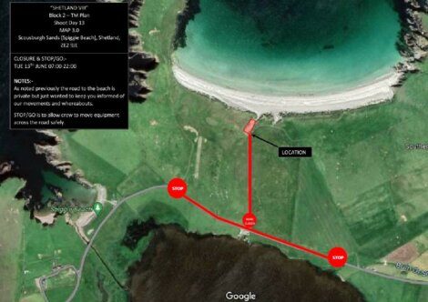 Aerial view of Scousburgh Sands beach with marked road stops for filming equipment movement. Two stop points and one caution point are indicated on the access road to the beach location.