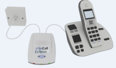 A cordless telephone set connected to a trueCall Secure device, featuring a wall-mounted socket, main unit, and handset with a digital display.