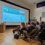 Audience attending a presentation on the benefits of membership in a conference room.