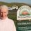 A smiling woman standing in front of a "welcome to scalloway caravan park" sign.