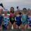 A group of women in swimsuits posing for a picture.