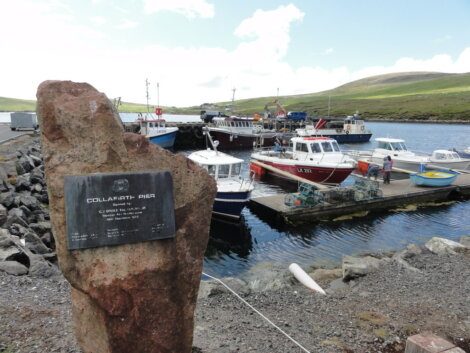 A large rock with a plaque on it.