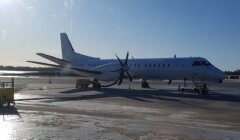 A white plane on the tarmac.