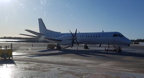 A white plane on the tarmac.