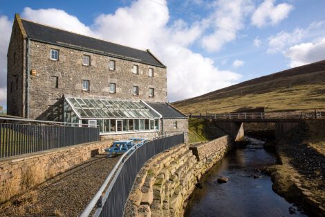 A building next to a river.