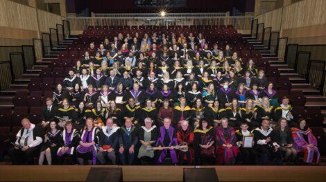 A group of people in graduation gowns.