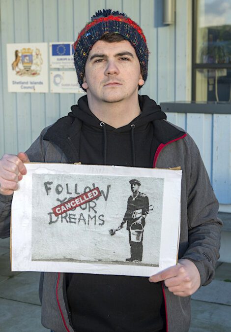 A man holding a sign.