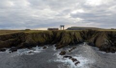 A rocky cliff with a launchpad on it.