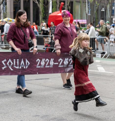 A girl holding a banner.