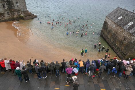 A group of people in the water.