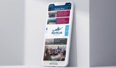 A mobile phone with the Shetland News displayed on it.