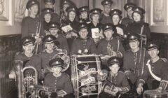 A group of people in uniform posing for a photo.