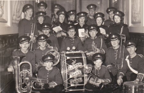 A group of people in uniform posing for a photo.