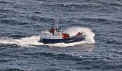 A boat in the middle of the ocean.