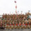 A group of people dressed in viking costumes posing for a photo.