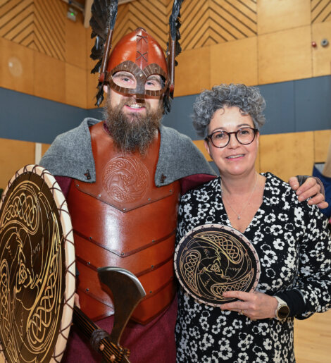 A woman wearing a viking costume.