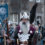 A man in a viking costume is walking down the street.