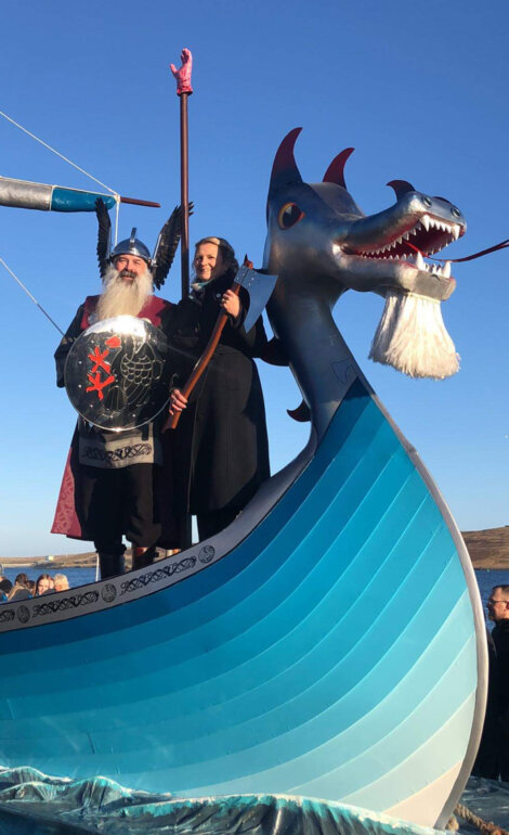 A boat with a dragon on it.