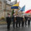 A group of men holding flags.