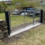 A stone gate in the middle of a field.