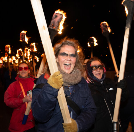 A group of people holding torches.