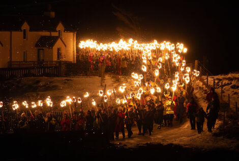 A group of people holding torches.