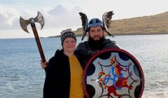 A man and woman wearing viking clothing.