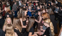 A group of people dancing in a large room.