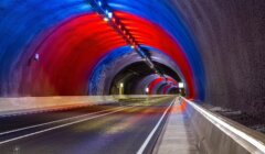 A tunnel with red, blue, and green lights.