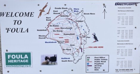 Map of Foula island with marked routes, including names of locations and features. Includes contact information for Directflight and a Foula Heritage sign.