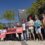 People are standing in front of an Equinor building, holding signs and banners with messages including "STOP BAY DU NORD" and "#EQUINOROUT" in a protest.