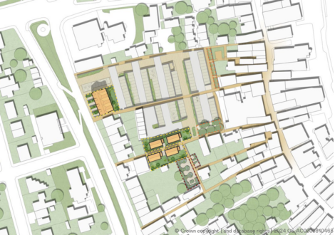 A detailed architectural site plan showing buildings, pathways, and green spaces in a developed area. Various structures are arranged in a grid-like pattern, with parking and landscaped areas visible.