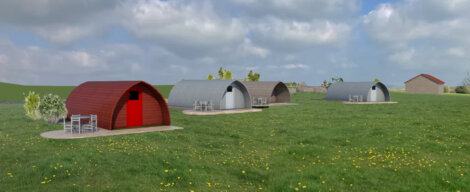 Three modern arch-shaped houses with varying facades, located on a green meadow dotted with yellow flowers under a clear sky.