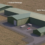 Aerial view of a simulated industrial site featuring labeled buildings for "statkraft" and "ssent," including a red car parked outside.