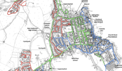 Map of Lerwick displaying speed limits: blue areas show 20 mph zones, green areas indicate 30 mph zones, and red outlines possible future 20 mph zones.