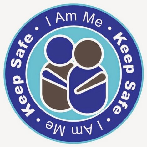 Logo showing two abstract human figures embracing, encircled by the text "Keep Safe - I Am Me - Keep Safe." The colors used are blue, teal, white, and brown.