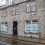 Street view of a stone building with windows displaying signage for "Lerwick Dental Practice" located at 4 Market Street.