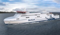 A large ferry named NorthLink sails on the water with mountains in the background.