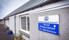 Exterior view of Sound Primary School building with a sign reading "Shetland Islands Council Sound Primary School Main Entrance.