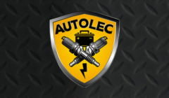 Emblem with two spark plugs and a battery, labeled "autolec," on a diamond plate background.